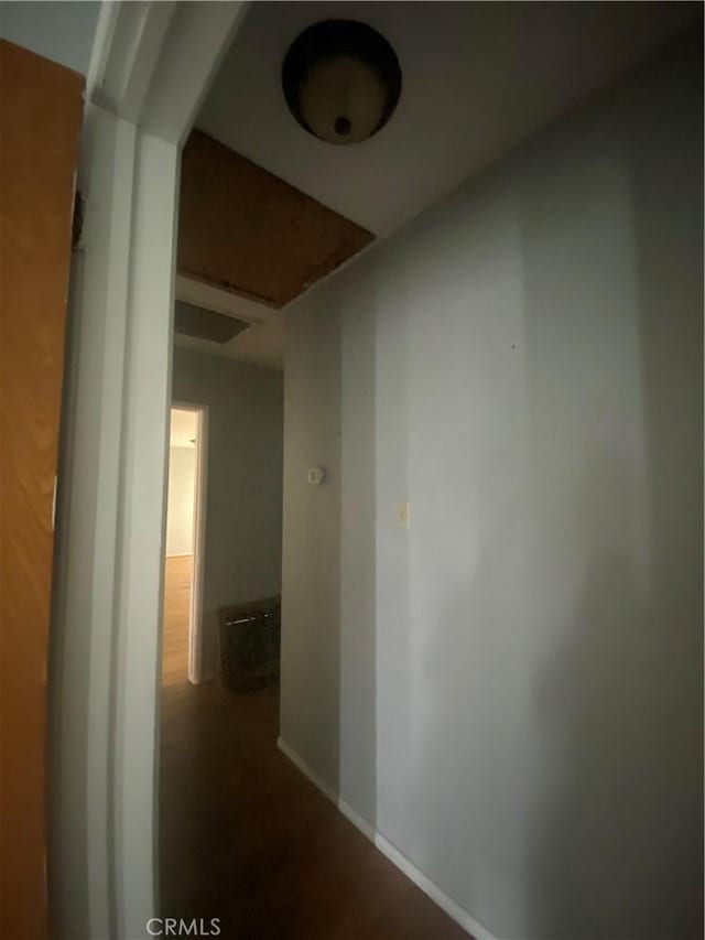 corridor featuring baseboards