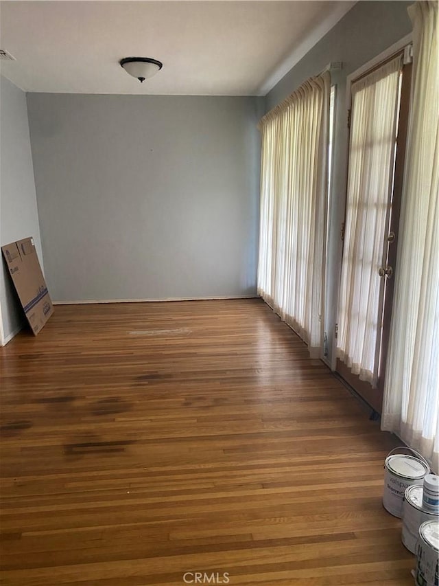 empty room with wood finished floors