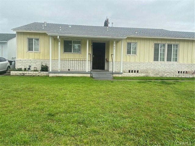 view of front of property featuring board and batten siding, a porch, a front yard, roof with shingles, and crawl space