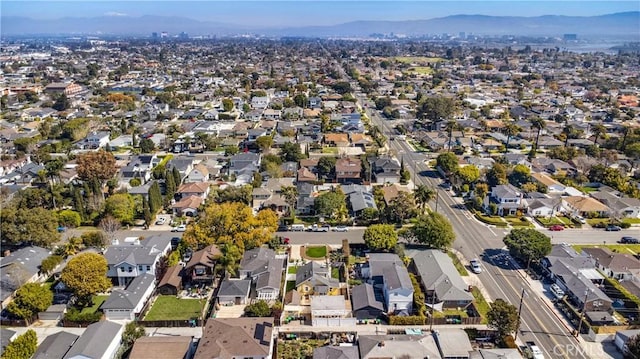 birds eye view of property with a mountain view and a residential view