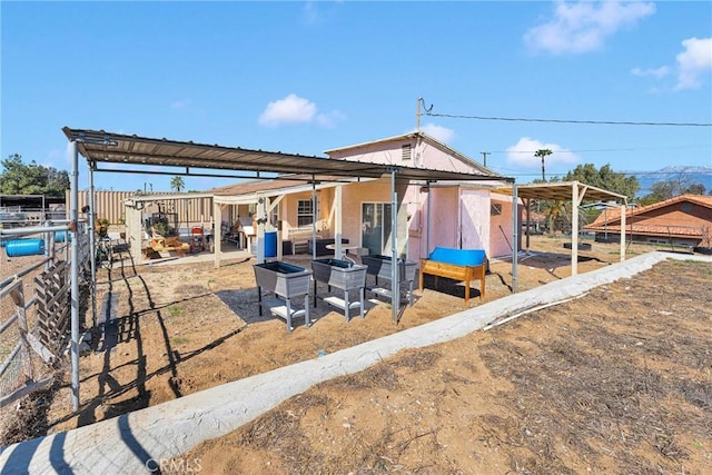 exterior space featuring a carport and a patio area