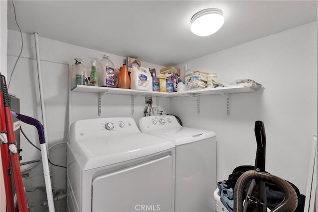 washroom featuring laundry area and separate washer and dryer