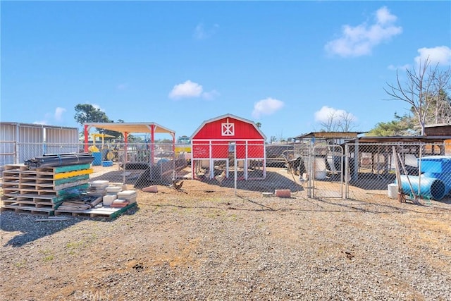 view of outbuilding featuring an outdoor structure and fence