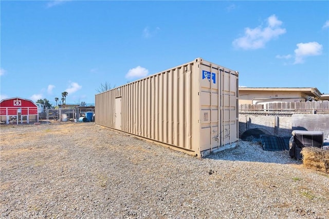 view of outdoor structure with fence