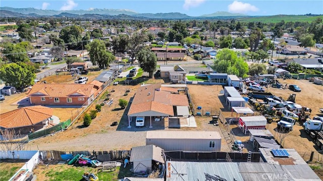 birds eye view of property featuring a mountain view and a residential view