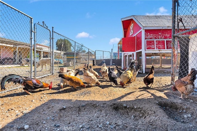 view of yard with an outbuilding and fence