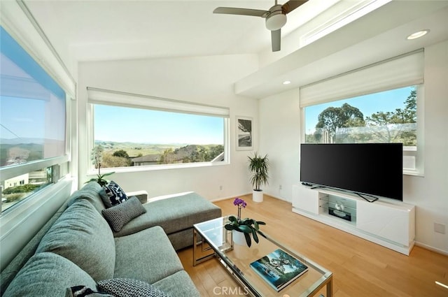 living room with vaulted ceiling, recessed lighting, wood finished floors, and ceiling fan