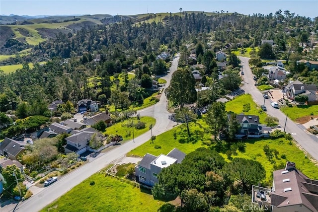 drone / aerial view with a residential view and a forest view