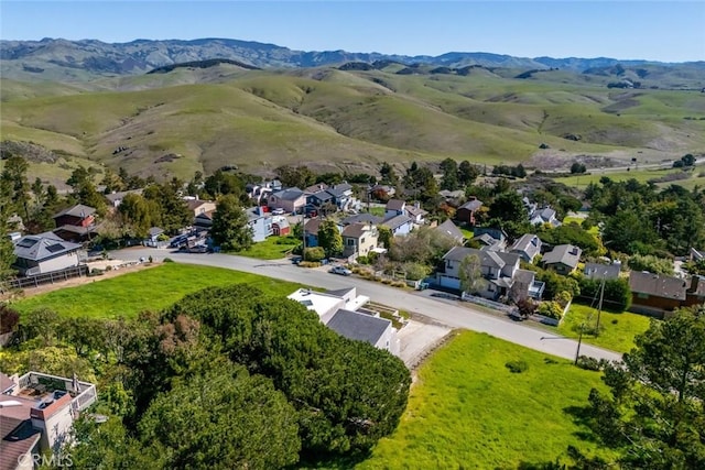 birds eye view of property with a residential view and a mountain view