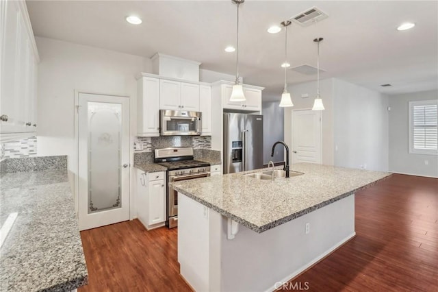 kitchen featuring a sink, stainless steel appliances, dark wood-type flooring, and visible vents