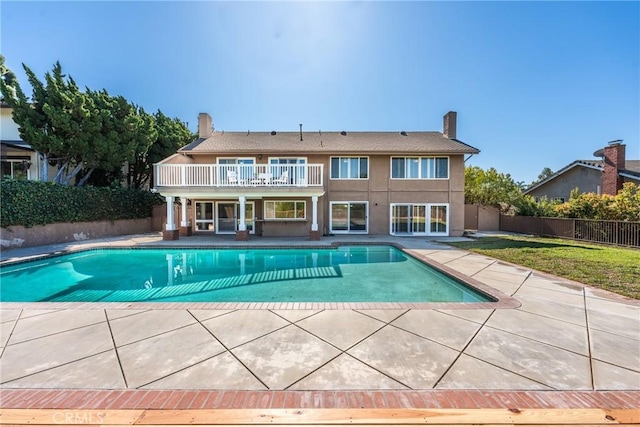 view of pool with a fenced in pool, a patio, a yard, and fence