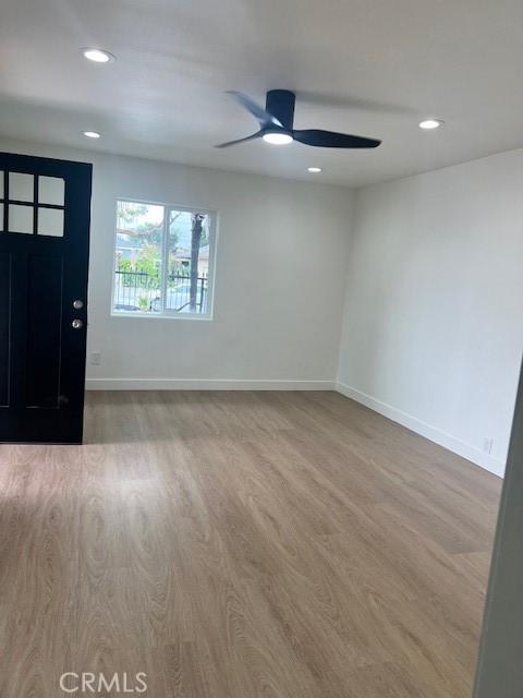 foyer entrance with recessed lighting, baseboards, wood finished floors, and ceiling fan