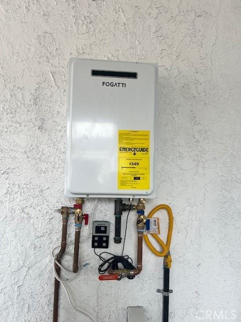 utility room with water heater