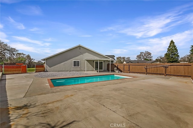 view of swimming pool featuring a patio, a fenced backyard, and a fenced in pool