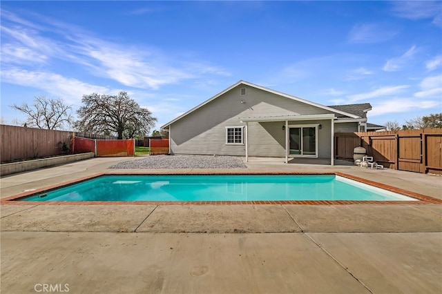 view of swimming pool with a fenced in pool, a patio, and a fenced backyard