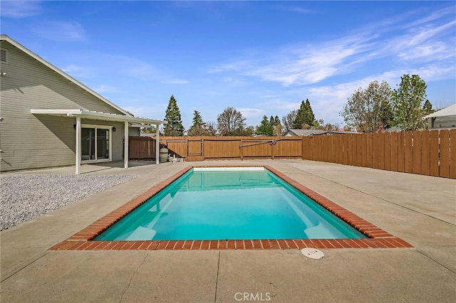 view of pool featuring a patio, a fenced backyard, and a fenced in pool