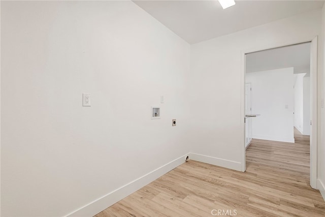 laundry room with electric dryer hookup, light wood-type flooring, washer hookup, baseboards, and laundry area