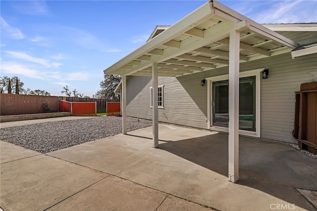 view of patio / terrace featuring fence