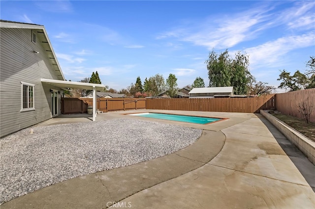 view of swimming pool with a fenced in pool, a patio, and a fenced backyard