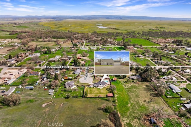 birds eye view of property with a mountain view and a residential view