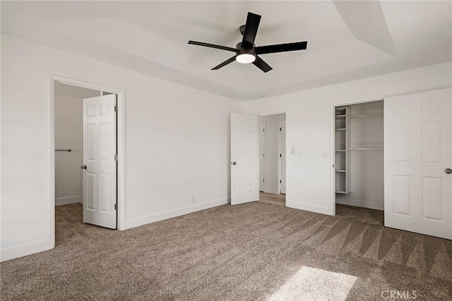 unfurnished bedroom with baseboards, carpet floors, and a closet