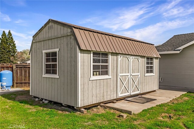 view of shed with fence