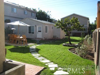 view of yard with fence and a patio area