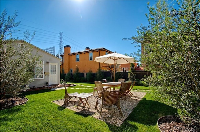 view of yard featuring a patio and fence