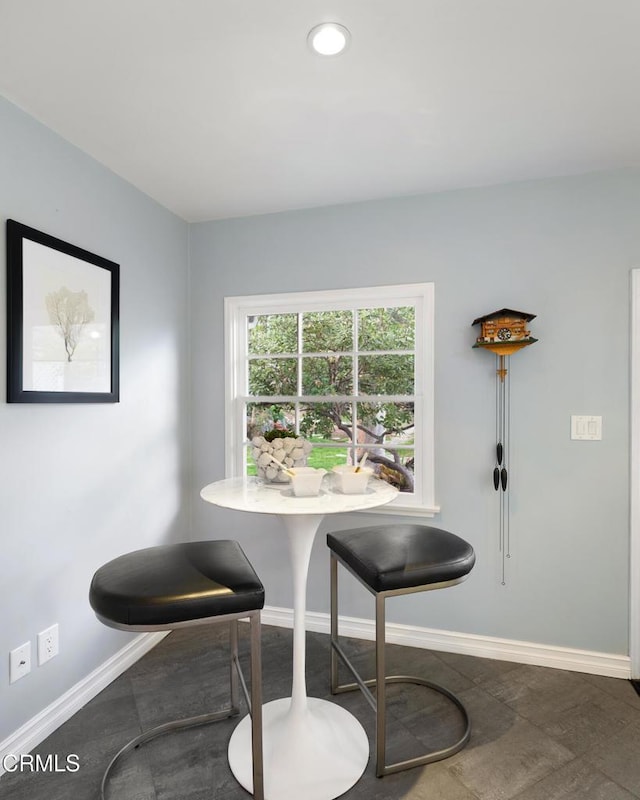 dining room featuring recessed lighting and baseboards