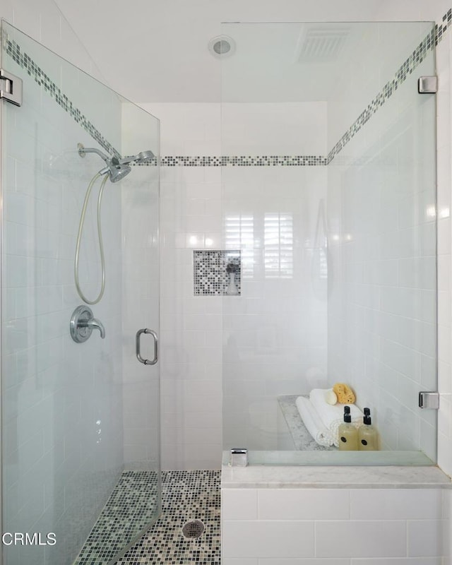 full bath featuring visible vents and a shower stall