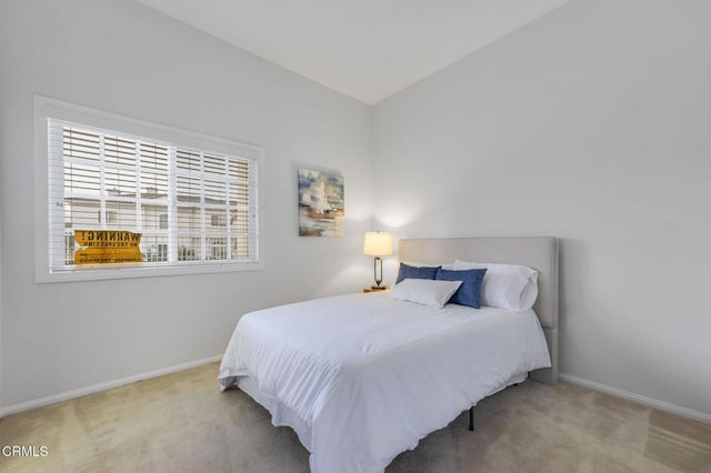 carpeted bedroom with baseboards