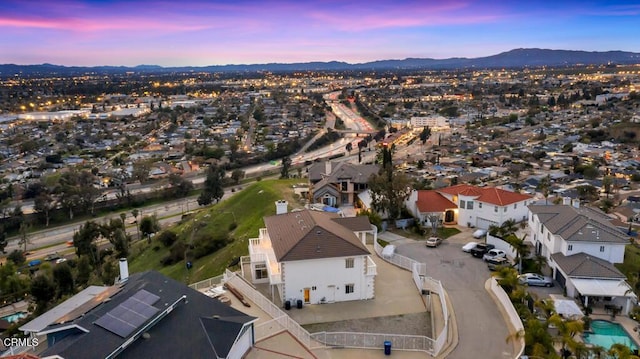 drone / aerial view with a residential view and a mountain view