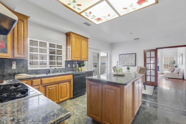 kitchen featuring visible vents, extractor fan, french doors, brown cabinetry, and black appliances