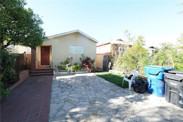 view of patio / terrace featuring fence