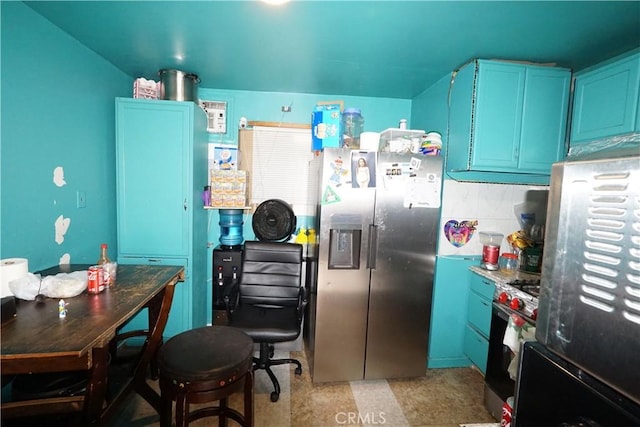 kitchen with blue cabinetry, tasteful backsplash, and stainless steel appliances