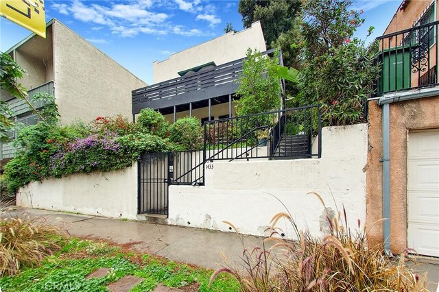 view of gate with stairs
