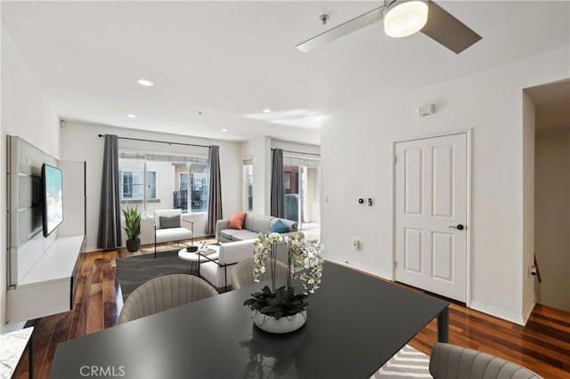 dining area featuring recessed lighting, baseboards, and wood finished floors