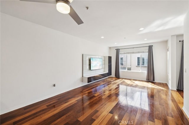 empty room featuring recessed lighting, baseboards, ceiling fan, and hardwood / wood-style flooring