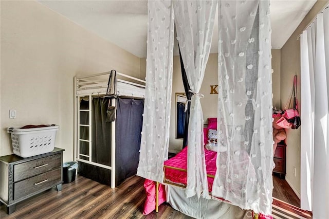 bedroom featuring wood finished floors