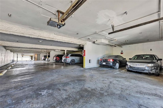 parking garage featuring a garage door opener