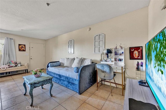 living room featuring tile patterned floors and a textured ceiling