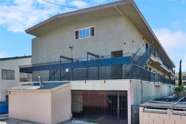 exterior space featuring stucco siding