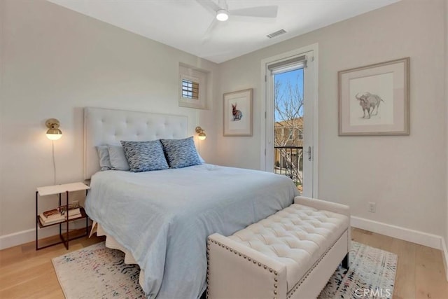 bedroom featuring access to exterior, visible vents, baseboards, and light wood-style floors