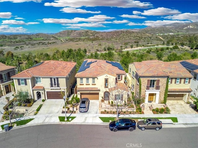 aerial view featuring a mountain view and a residential view