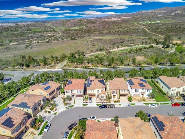 birds eye view of property with a mountain view and a residential view