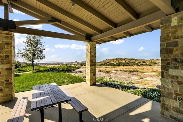 view of patio / terrace with a mountain view