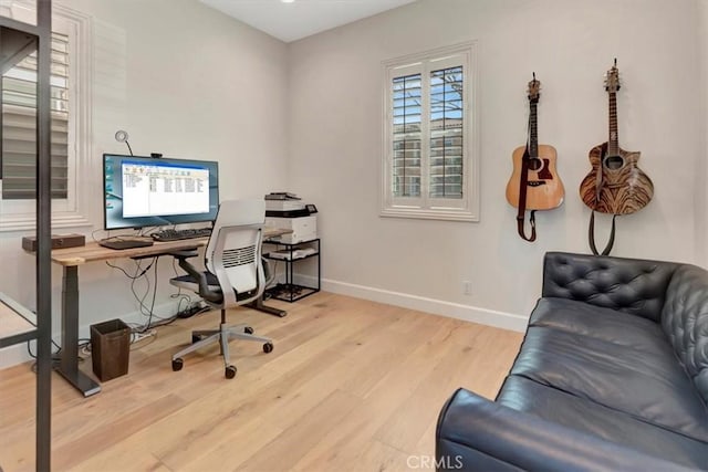 office area featuring wood finished floors and baseboards