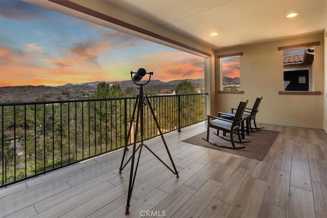 balcony at dusk with a mountain view