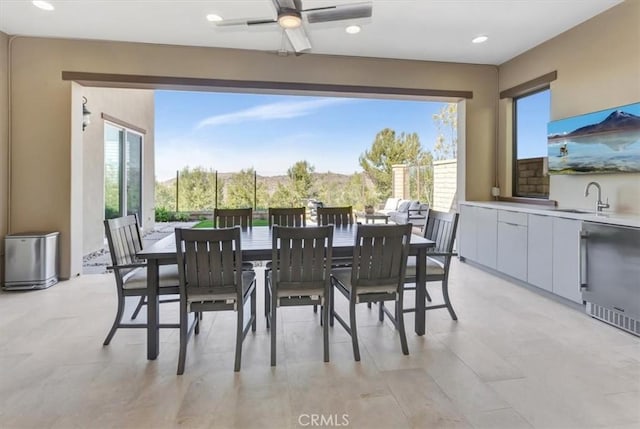 dining space with a ceiling fan, recessed lighting, and a healthy amount of sunlight