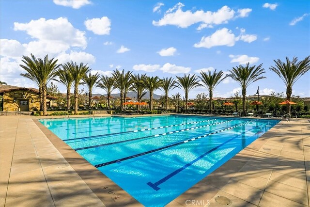 community pool featuring a patio area